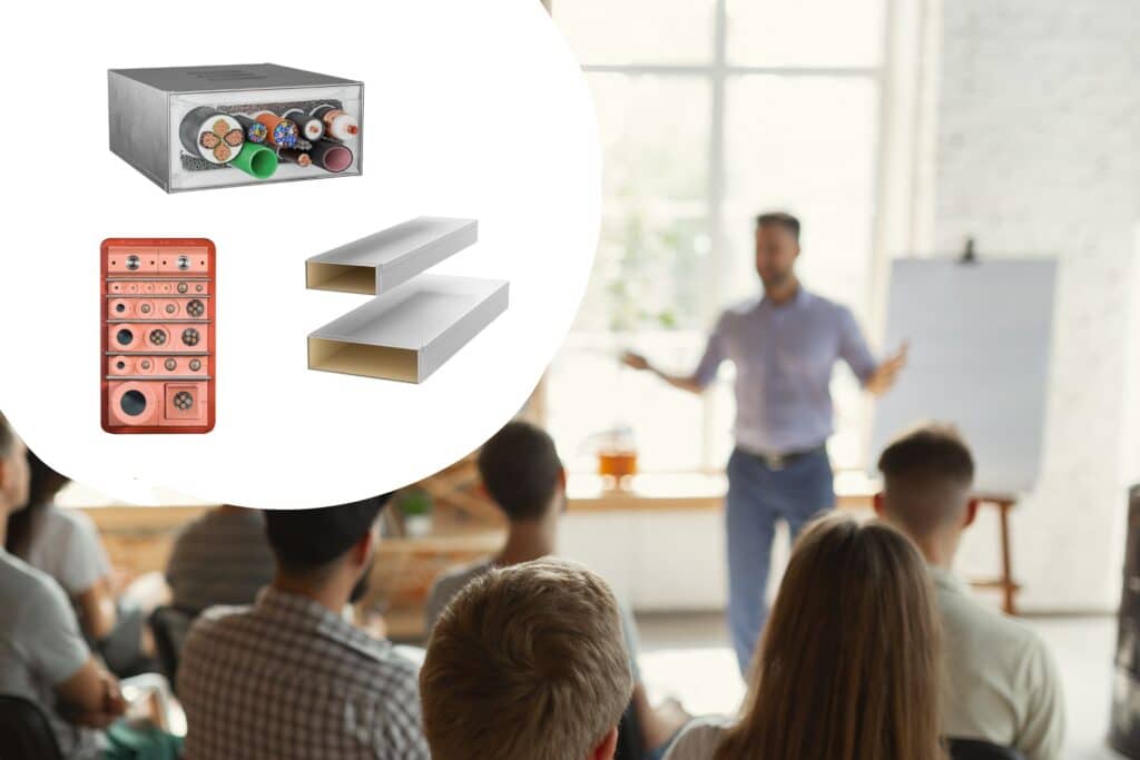 Brandschutzschulung mit Publikum; im Fokus Abschottungssysteme und INSTAFIX Brandschutzkanäle als grafische Einblendung für praxisnahe Vermittlung von Kabel- und Rohrabschottungen