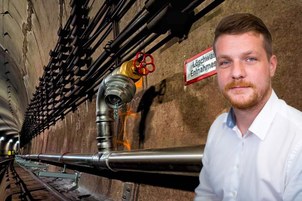 Edelstahl-Löschwasserleitung in einem Tunnel mit Entnahmestelle und Porträt eines Fachplaners im Vordergrund.