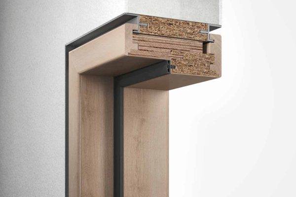 Detailansicht einer Holz-Blockzarge System S im Wandquerschnitt mit Fokus auf den Materialaufbau der Konstruktion.