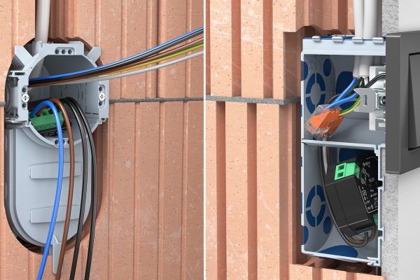 Elektroinstallateure bei der Montage effizienter Unterputzdosen mit Klemmen für eine normgerechte Elektroinstallation.