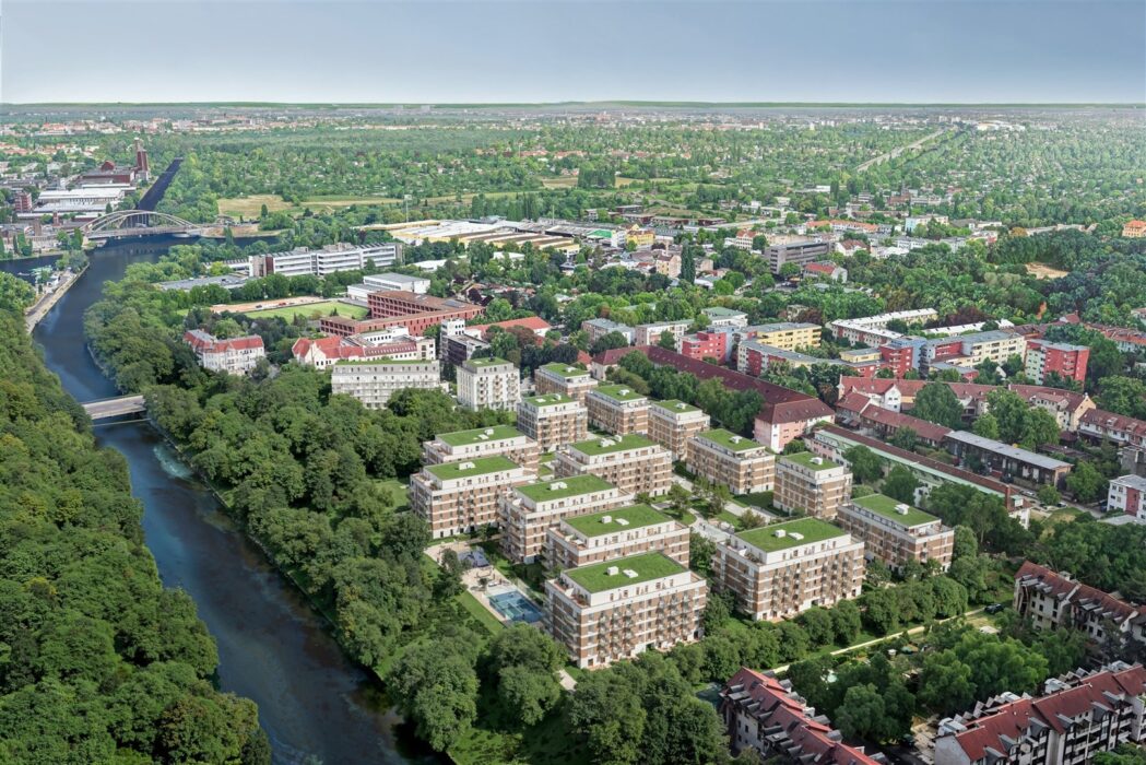 Greenpark Berlin aus der Vogelperspektive mit modernen Wohnhäusern und begrünten Dächern am Fluss