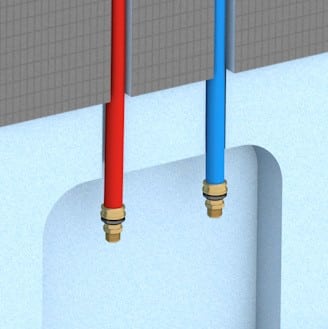 Detailansicht zweier Wedi-Wasseranschlüsse für Warm- und Kaltwasser in einer Installationswand.